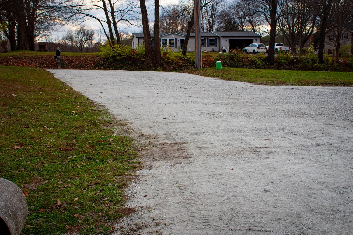 Freshly graded gravel driveway on a rural central Indiana property