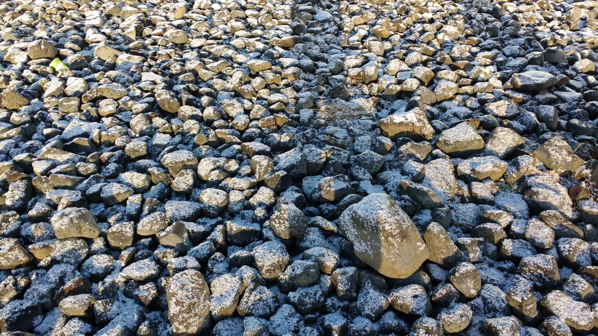 Rock riprap placed for erosion control where runoff crosses a central Indiana property