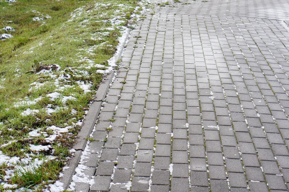Permeable paver surface with grass joints managing surface water in central Indiana