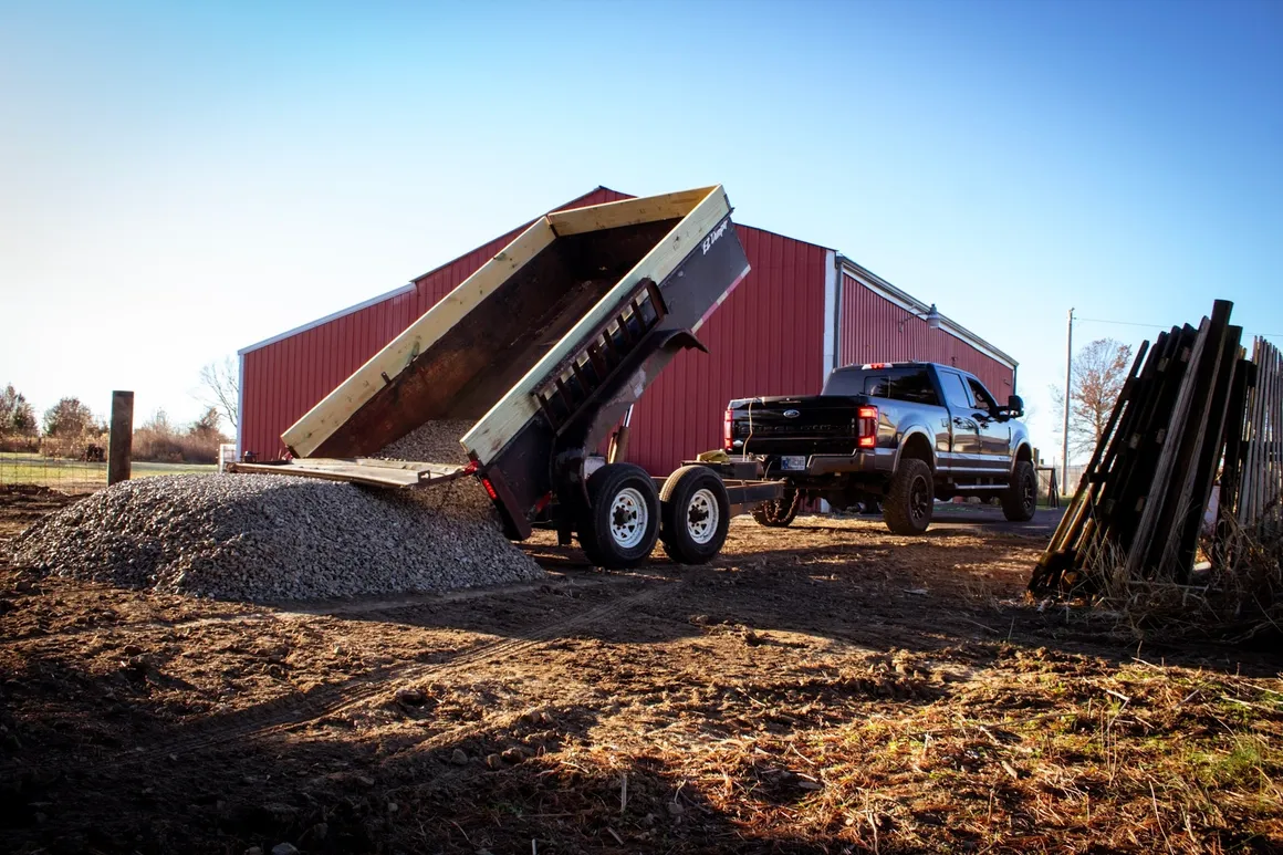 Dump truck hauling cleared material from a rural property in central Indiana