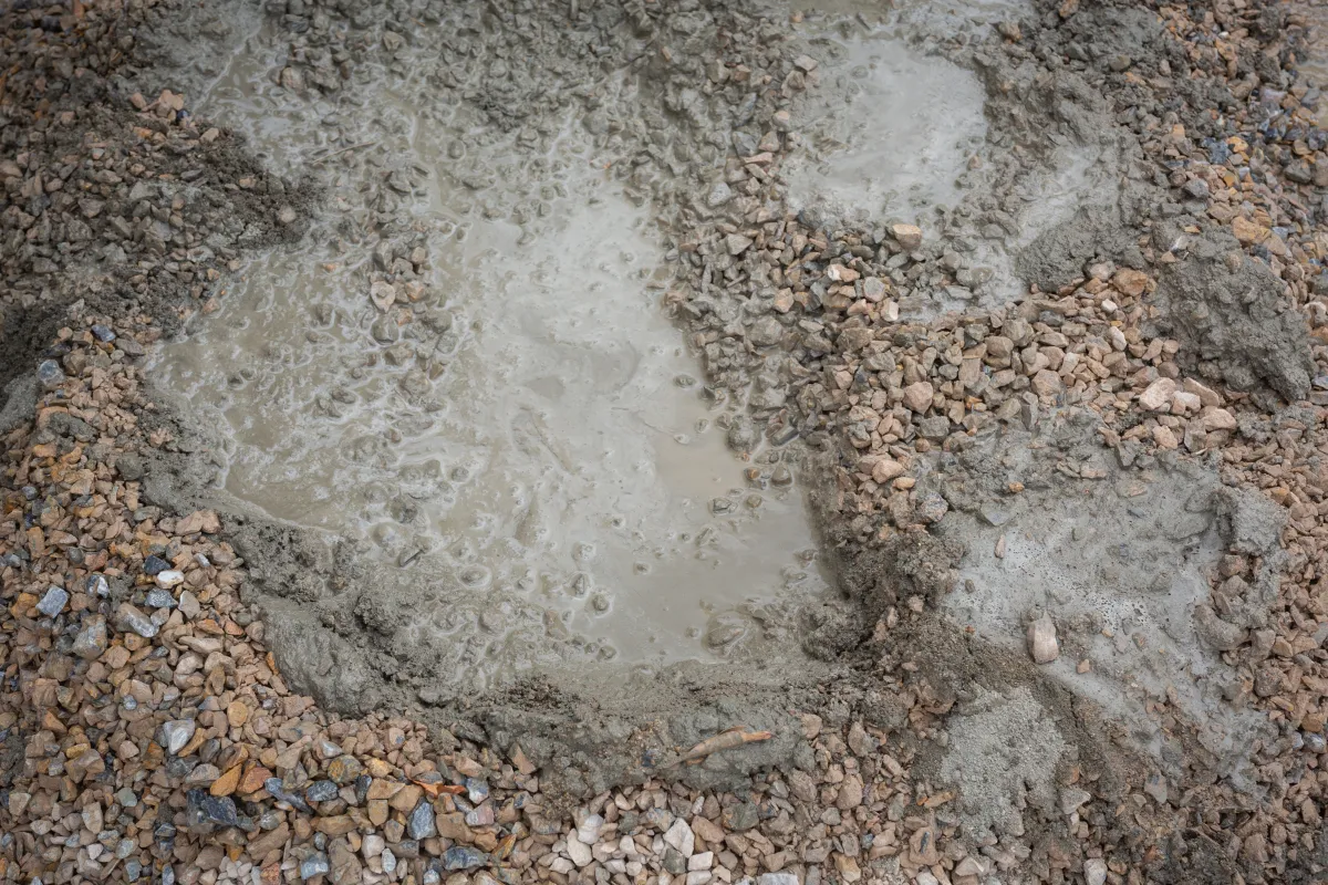Water pooling in saturated, muddy ground over broken-down field drainage in central Indiana